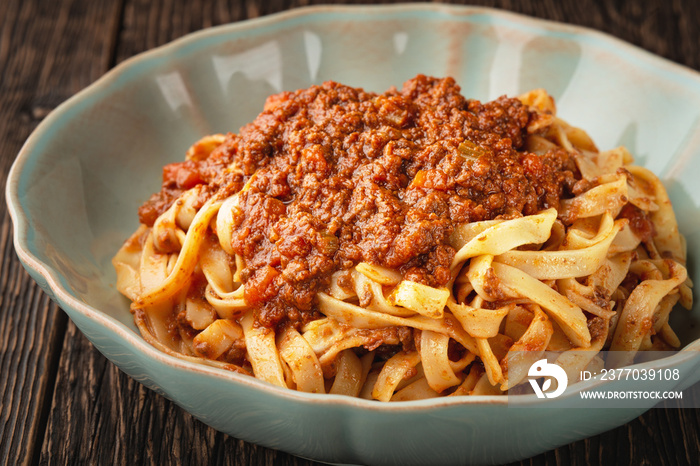 Close-up plate pasta tagliatelle with BOLOGNESE SAUCE