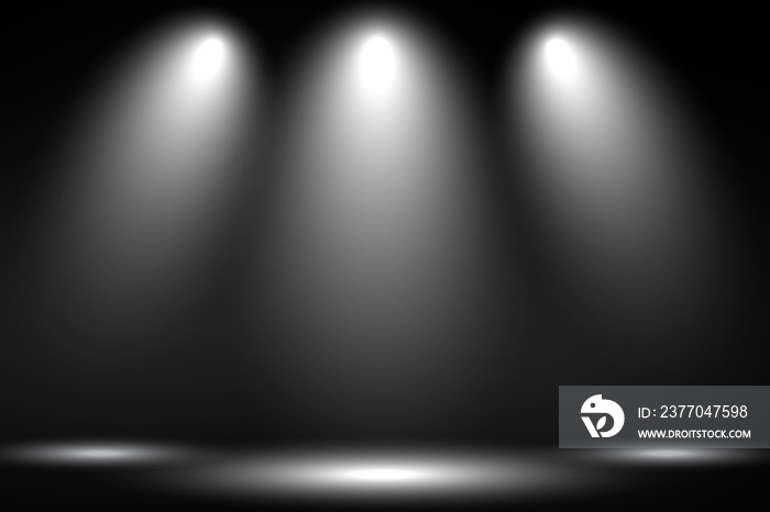 White stage with spot lighting in black background.