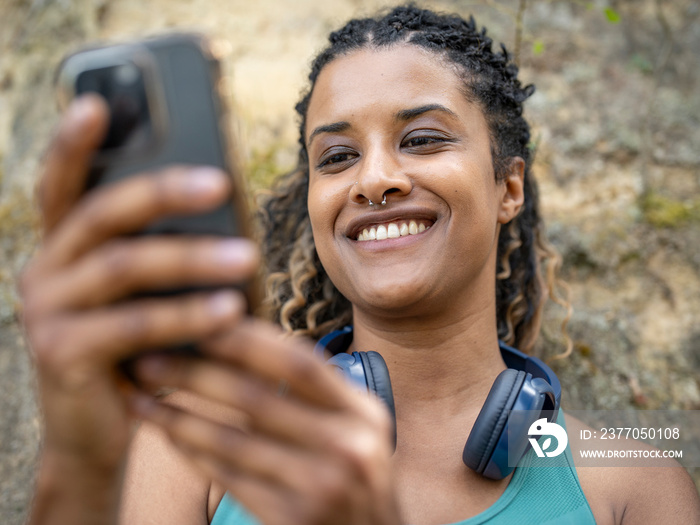 Portrait of smiling woman using smart phone