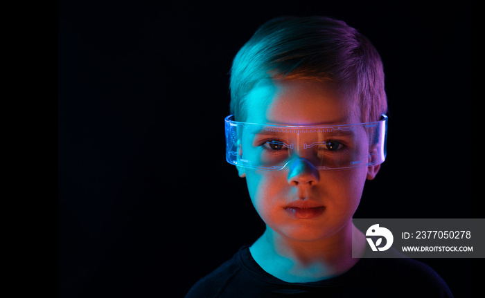 Cute little boy using digital glasses. sci-fi, earth awareness, future mind controlling concept