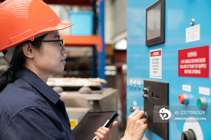 young asian woman engineer set up and testing machine in the laboratory factory, engineering and industrial concept