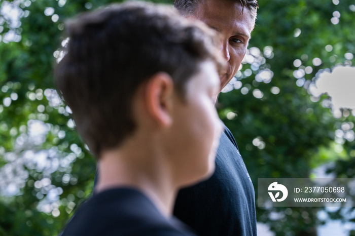 Air Force service member trains with his sons in a morning workout in preperation for a PT fitness test.