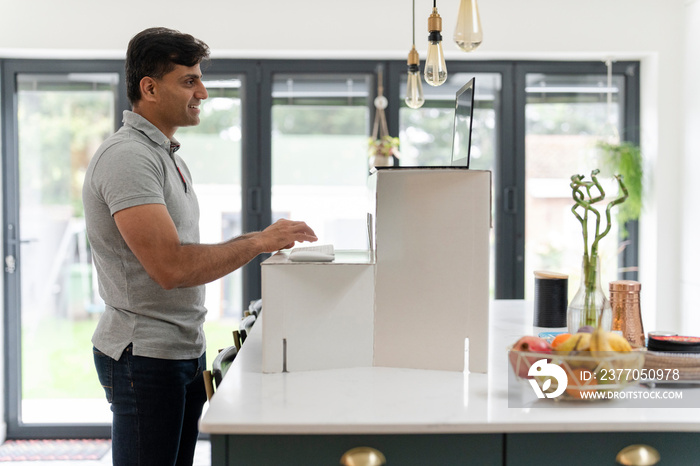 Man working on laptop at home