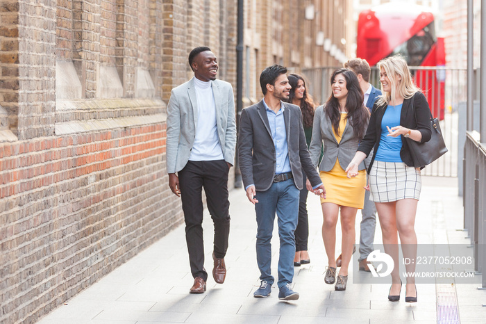 Group of young professional walking in the city