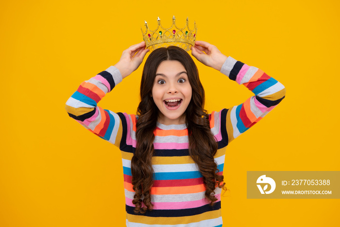 Amazed teenager. Little queen wearing golden crown. Teenage girl princess holding crown tiara. Prom party, childhood concept. Excited teen girl.