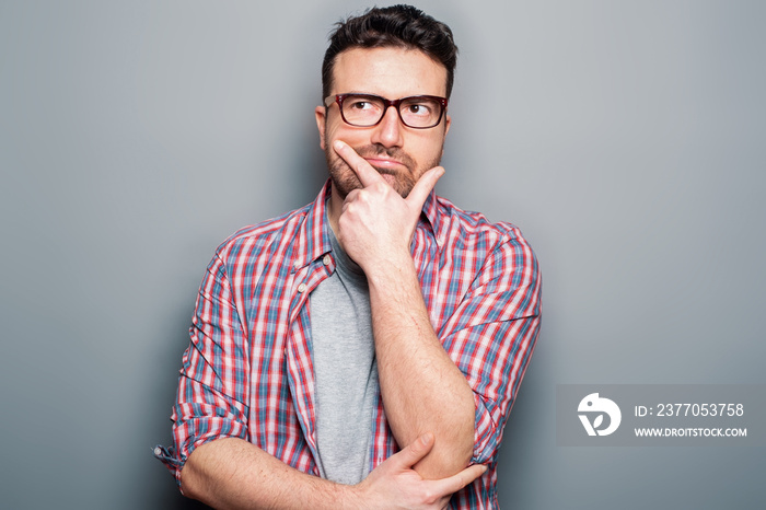 Thoughtful man portrait isolated on background