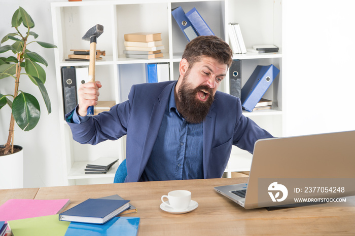 Destroy laptop. Hateful job. Bad computer. Mad manager. Annoyed user. Slow internet connection. Outdated software. Computer lag. Lagging system. Hate office routine. Man bearded crush computer