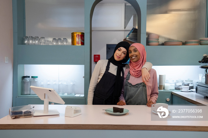 Portrait of smiling young women working in cafe