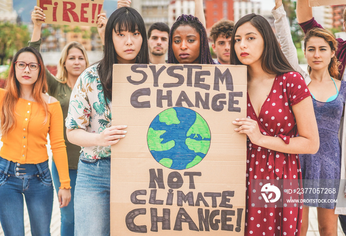 Group of demonstrators on road, young people from different culture and race fight for climate change - Global warming and enviroment concept - Focus on afro girl face