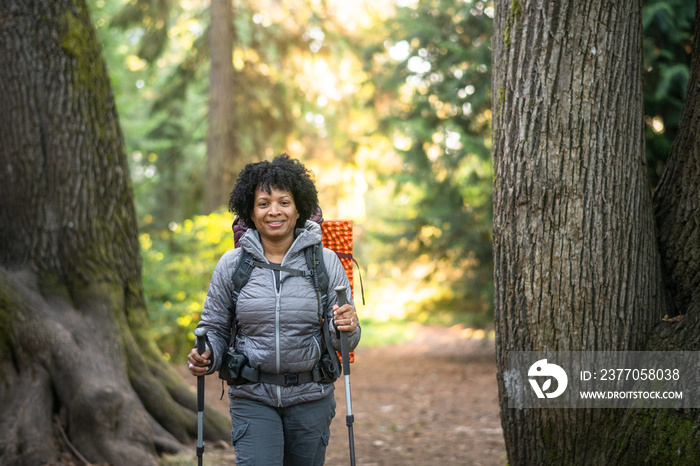 U.S. Army female soldier putting in the miles with an early morning hike in the NorthWest.