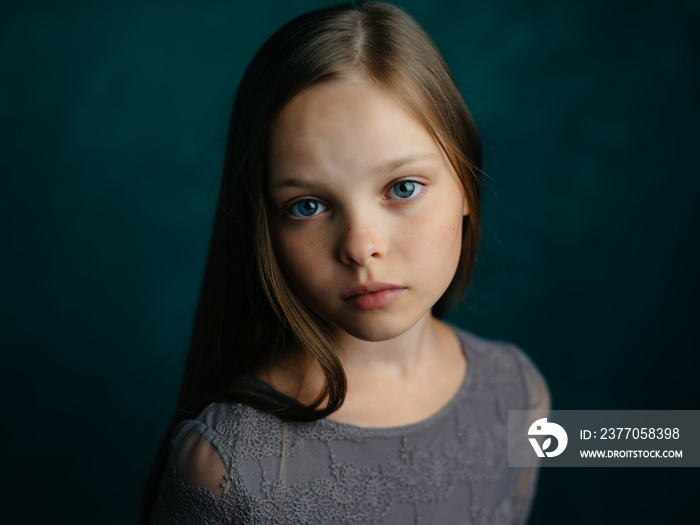 little girl long hair posing green background