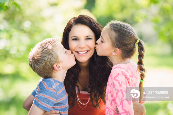 Children Kissing Mother