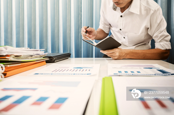 Vat and loan rates calculated by the bank of according to the tax code of the government. Business man asian hard working in the office calculating tax income.