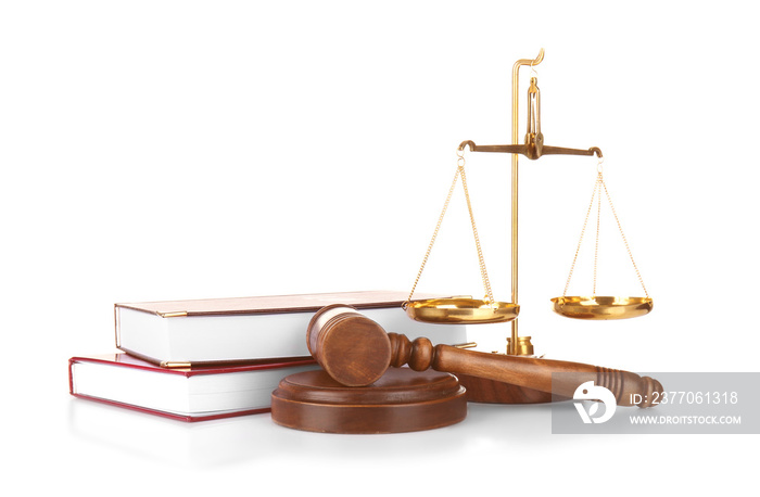 Judge gavel, scales and books on white background