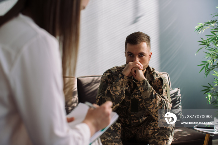 Male military officer having appointment with psychotherapist in office