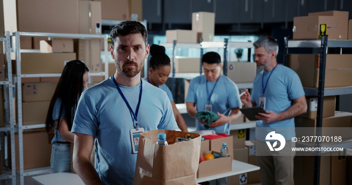 Portrait of caucasian volunteer worker colecting food suppy box for elderly people coworking helping others during coronavirus lockdown quarantine.