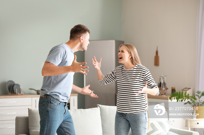 Angry couple having arguments at home