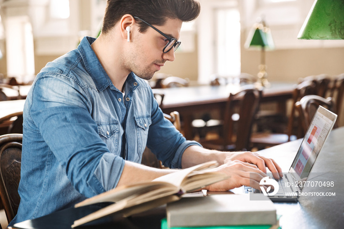 Smiling male student studying