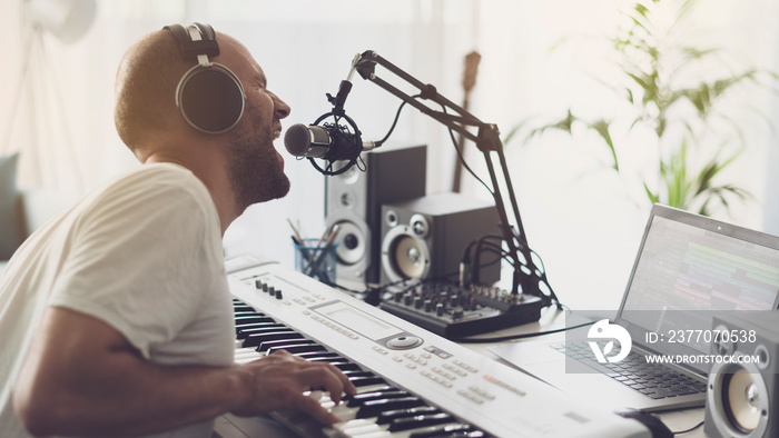 Musician singing and playing a digital piano