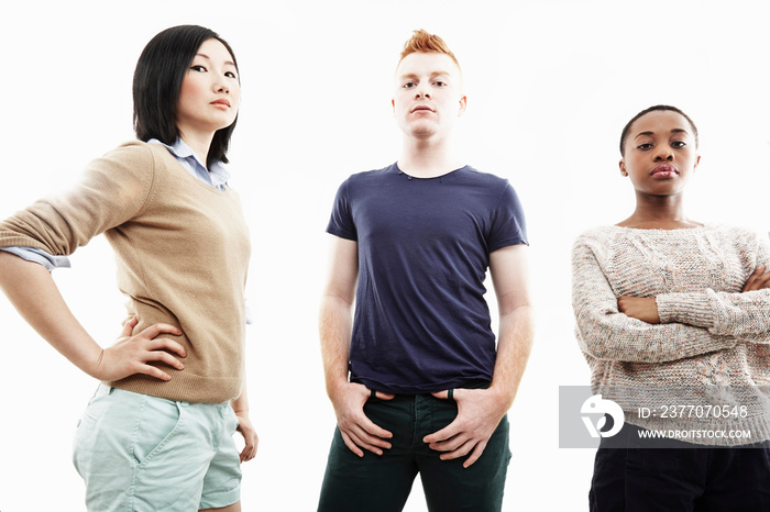 Studio portrait of three young individual adults