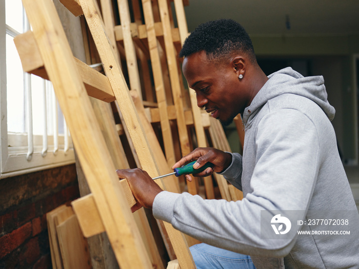 Carpenter using screwdriver