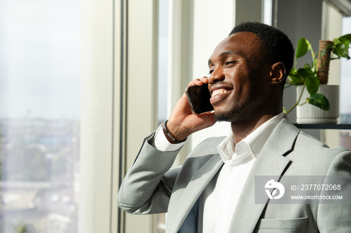 Young businessman using smart phone