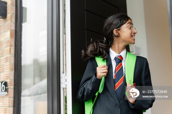 Schoolgirl leaving home for school