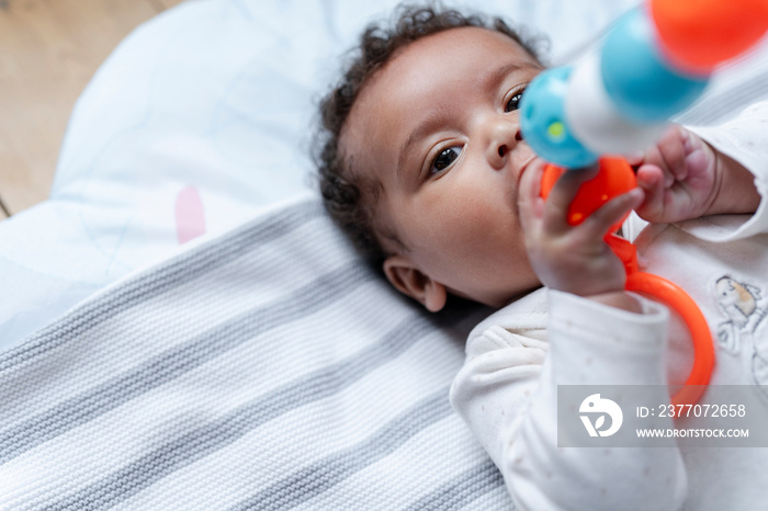 Baby girl holding toy