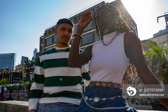 Fashionable young friends in city,looking at camera