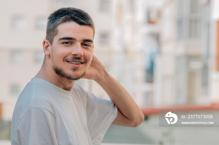 portrait of young boy with beard or goatee in the city outdoors