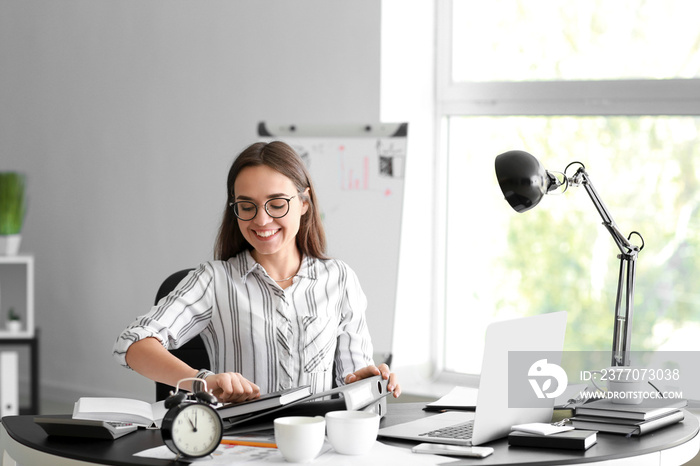 Happy businesswoman finishing her job in time