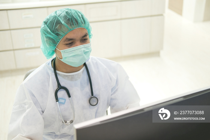 Doctor watching the film x-ray on screen monitor computer in covid-19 ward