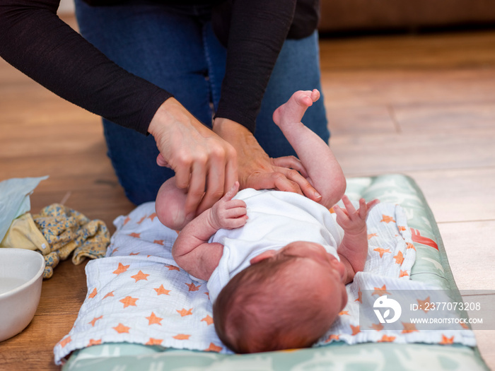 Mother infant daughters   diaper