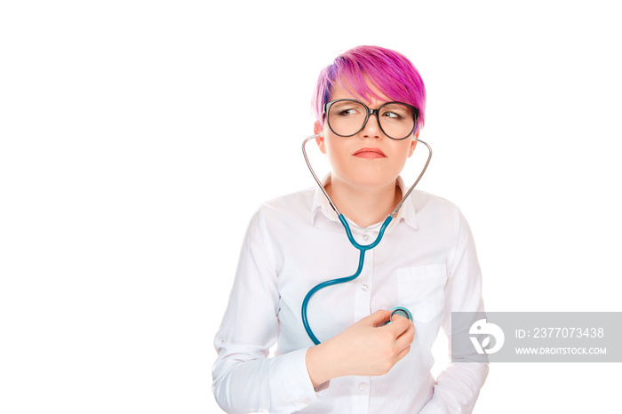 Confused woman listening herself with stethoscope