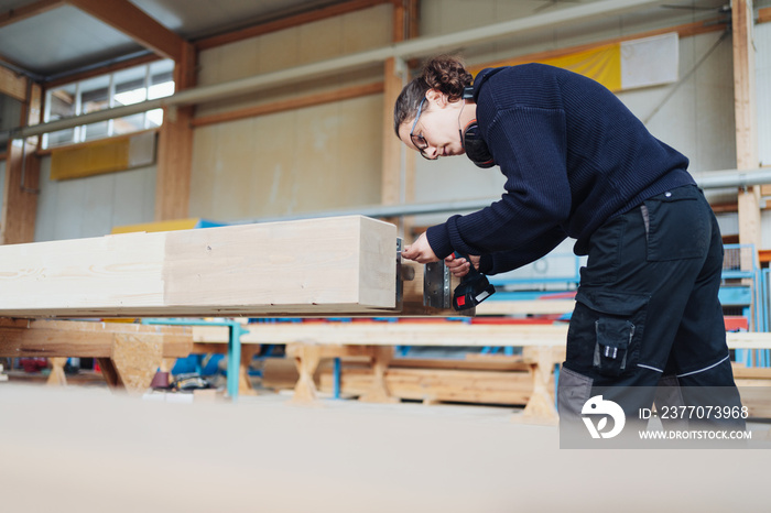 Female worker in a woodworking or carpentry workshop