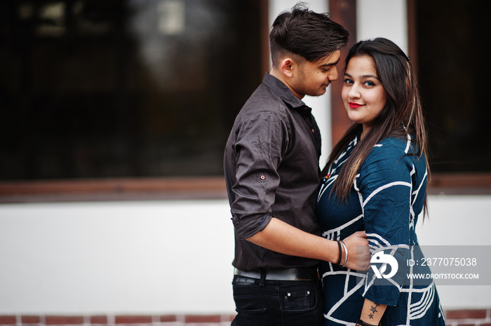 Love story of indian couple posed outdoor.