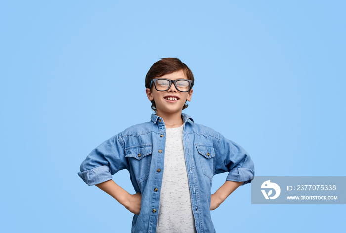 Proud confident boy in eyeglasses