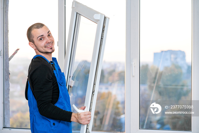 Professional master at repair and installation of windows, at work