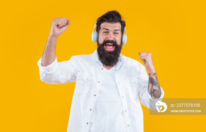 cheerful dj man wearing music headphones in studio. man listen music in dj headphones.