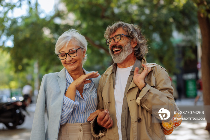 Cheerful senior couple outside.