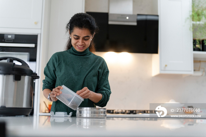 Woman preparing food in kitchen