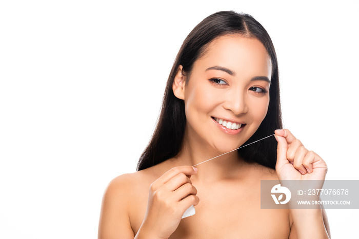 smiling asian naked woman with dental floss isolated on white