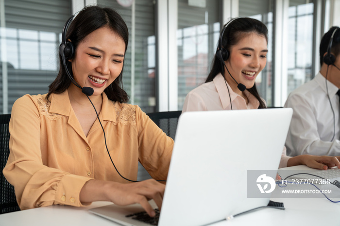 Business people wearing headset working actively in office . Call center, telemarketing, customer support agent provide service on telephone video conference call.