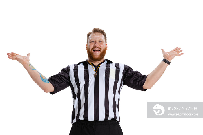 Portrait of happy, excited soccer or football referee wearing field judge uniform isolated on white studio background. Concept of sport, rules, competitions, rights, ad, sales.