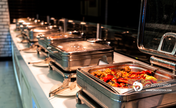 Breakfast and lunch buffet food catering banquet in hotel. Heated buffet container with meat and pepper