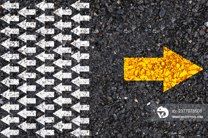 Different thinking and Business and technology disruption concept. Yellow arrow opposite  direction with white arrow on road asphalt.