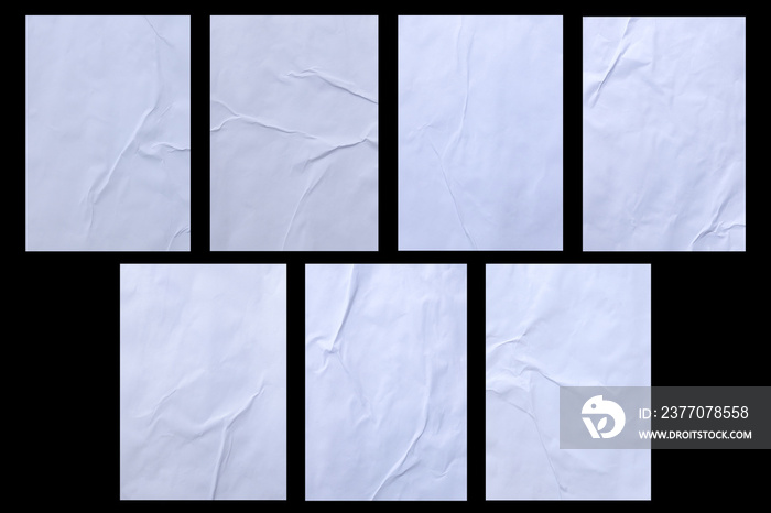 Variety of blank white crumpled and creased sticker glued paper poster texture isolated on black background.