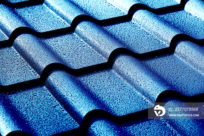 Metallic roof with drops of water. Macro image.