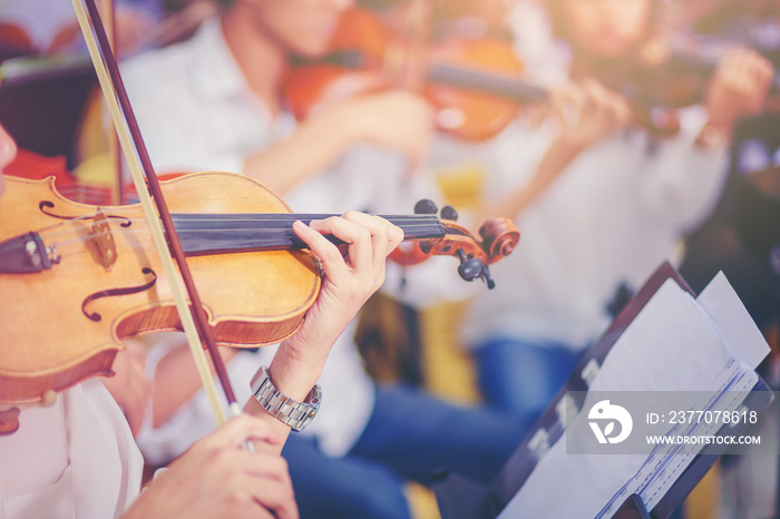 Musician is practicing violin in a music practice classroom prepare for performing violin stage. Concept of practicing violin for professional skills. Selected focus