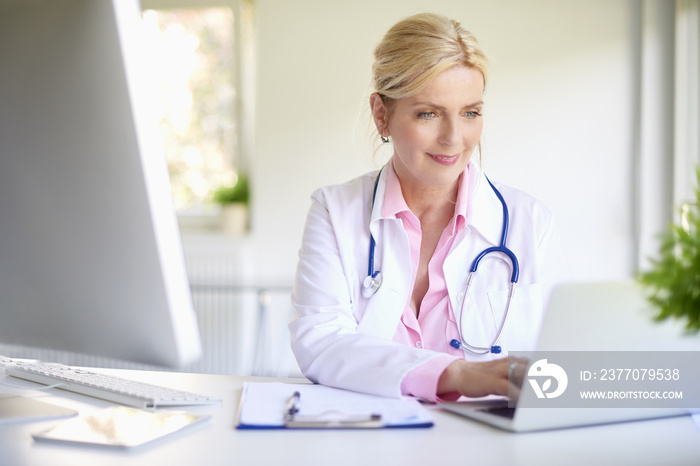 Female doctor with laptop